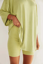 Load image into Gallery viewer, Green-colored 2 piece lounge set showcasing a relaxed-fit top and matching bottoms, providing a stylish and comfortable loungewear option.
