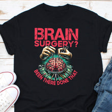 Load image into Gallery viewer, a black t - shirt with a picture of a human brain on it
