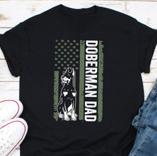 Load image into Gallery viewer, a black shirt with a doberman and dad design on it
