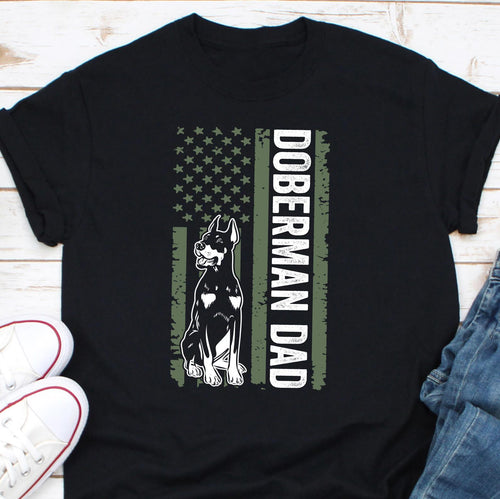 a black shirt with a doberman and dad design on it