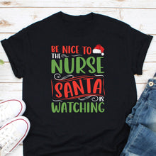 Load image into Gallery viewer, Be Nice To The Nurse Santa Is Watching Shirt, Nurse Christmas Shirt
