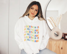 Load image into Gallery viewer, Abortion Is Healthcare Hoodie, Abortion Rights Sweatshirt, Protest Shirt, Women&#39;s Rights Shirt
